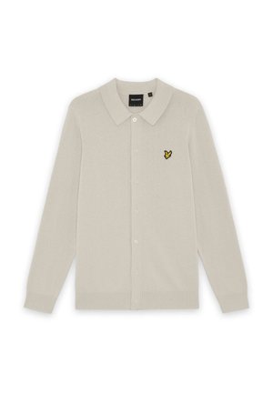 Lys beige cardigan med lange ærmer, knapper og krave samt en lille gul og sort fuglelogo på venstre bryst.