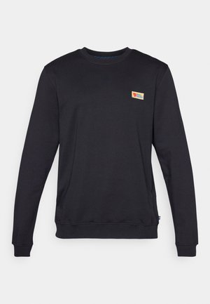 Sweatshirt preto de gola redonda com mangas longas, feito de material macio. Apresenta um pequeno logótipo colorido no canto superior esquerdo do peito.
