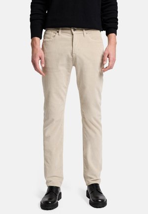 - Spodnie materiałowe