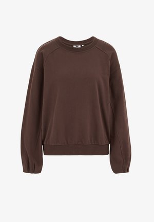 Ruda, ilgomis rankovėmis džemperis; laisvo kirpimo su dygsniuotais rankogaliais ir apačia. Lygi tekstūra, apvalus kaklo iškirptė ir raglano rankovės. Be matomų raštų.