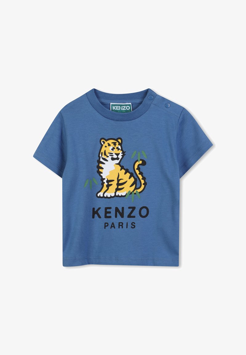 T-shirt en coton bleu à manches courtes avec un graphique de tigre et le texte "KENZO PARIS". Fermeture par pression à l'épaule et finition lisse.