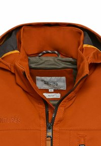 Orange jacket with a zip closure, mesh lining, and branded label. Features contrast stitching and recycled material accents.