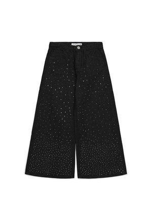 Jeans neri a gamba larga cropped con piccole borchie argentate distribuite densamente in basso e diradate verso la vita.