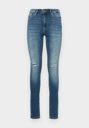 Jeans skinny en denim bleu moyen, avec des déchirures aux genoux, un design à cinq poches et une fermeture à bouton avec un zip.