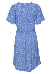 Blue floral dress with short sleeves, featuring a gathered waist, lightweight fabric, and a flowing silhouette. Small white flower pattern throughout.