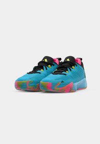Blue athletic shoes with black accents, pink heel tabs, textured upper, and multi-colored rubber sole featuring wavy patterns.