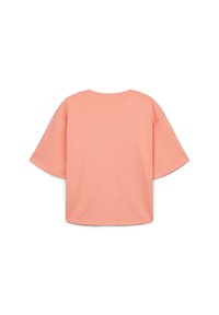T-shirt oversized a maniche corte in corallo pastello, realizzato in morbido cotone. Presenta un collo rotondo e spalle con caduta per un fit rilassato.