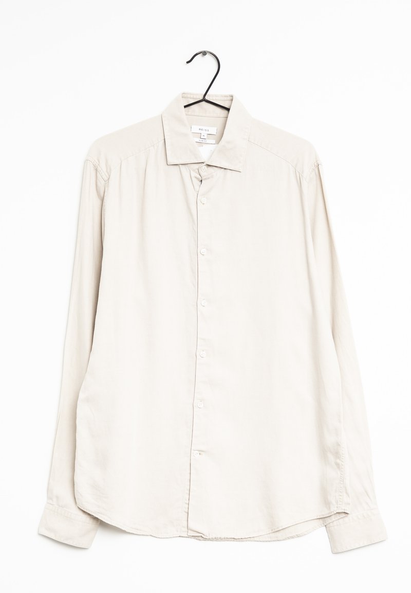 Lichtbeige lange mouwen shirt gemaakt van gladde stof. Heeft een puntige kraag, volledige knoopsluiting en afgeronde zoom.