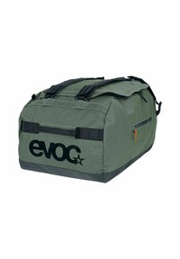 Green duffle bag made of textured fabric, featuring a large black logo, contrasting dark base, dual handles, and a side zip pocket.