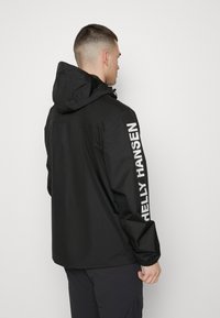 Helly Hansen ERVIK - Regenjas - black