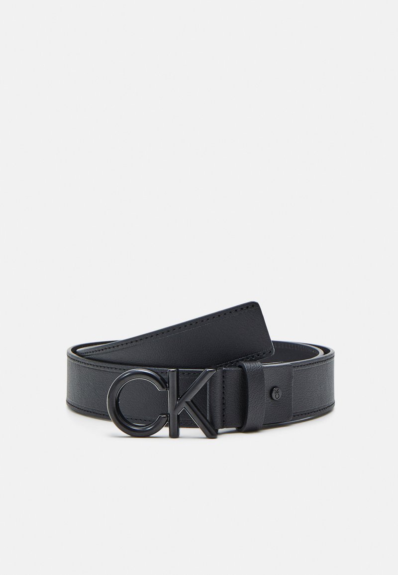 Black leather belt featuring a smooth texture, a slim design, and a prominent black CK logo buckle.