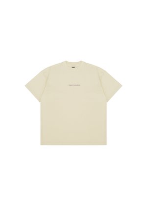 Cream-colored cotton t-shirt featuring short sleeves, a crew neckline, and 'legacy studios' logo printed in small font on the chest.