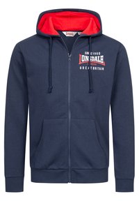Felpa con zip di colore blu navy, con interno rosso, cappuccio con coulisse, tasche frontali e testo del logo bianco sul petto. Tessuto misto cotone, vestibilità casual.
