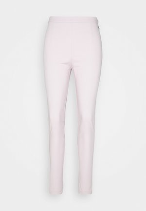Light pink slim-fit pants with high waist and side zipper closure, shown against a plain white background.