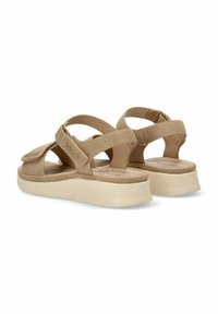 Sandalias beige con textura de ante, correas de tobillo ajustables y una suela de plataforma acolchada para mayor comodidad. Presentan detalles de costura cruzada.
