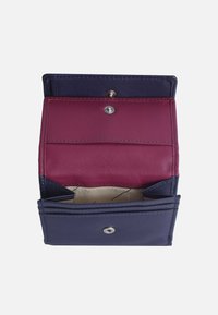 Leather wallet in navy and maroon, featuring multiple card slots and compartments, with a snap closure and smooth texture.