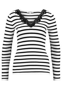 Haut à manches longues rayé noir et blanc avec une texture côtelée et un col en dentelle noire festonné. Présente une coupe ajustée.