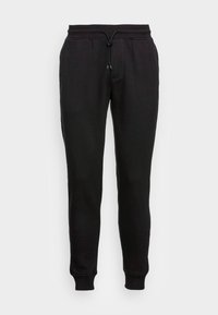 Svarta bomullssvetare med justerbart midjeband, avsmalnande ben och ribbade muddar. Enfärgad utan synliga mönster eller detaljer.