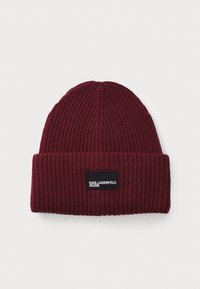 Burgundy knit beanie with ribbed texture, featuring a black rectangular label with "KARL LAGERFELD JEANS" in white text on the front.
