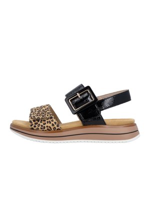 Comfort sandal with leopard print front strap, black patent ankle strap with large rectangular buckle, padded tan footbed, and white sole.