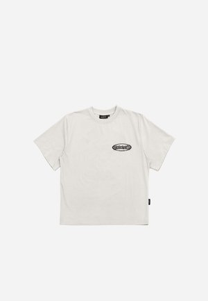 White cotton t-shirt with a relaxed fit, round neck, short sleeves, and a black graphic logo on the left chest. Soft texture, no patterns.