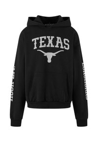 Crna dukserica s grafikom u sivoj boji koja glasi "TEXAS" i prikazuje dugouhi rogovima. Sadrži prednji džep te rebraste manžetne i donji rub.