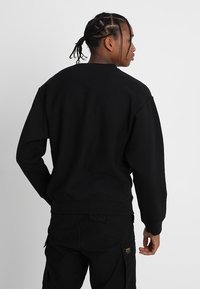 Carhartt WIP AMERICAN SCRIPT - Camisola - black