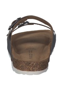 Sandalo nero con cinturino regolabile, soletta in sughero e suola bianca. Parte superiore texturizzata e interno liscio. Design ergonomico per il comfort.