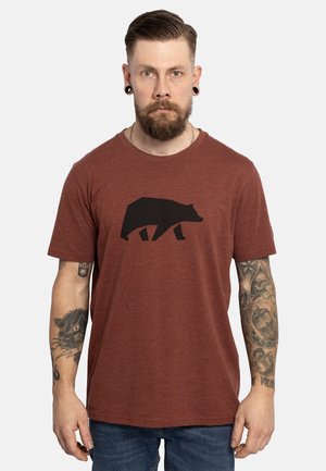 Camiseta de manga corta marrón de brezo con un gráfico de un oso negro centrado en la parte delantera. Cuello redondo y corte relajado.
