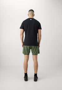 Dynafit ULTRA SHORTS - Lauko šortai - thyme