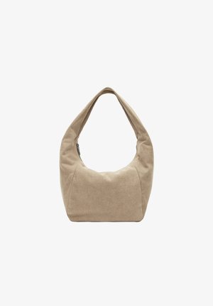 Sac hobo en tissu beige avec une poignée supérieure courbée, une forme arrondie et une texture lisse. Comprend une fermeture éclair et un design minimaliste.