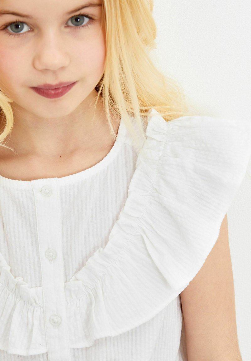 Kinder T-Shirts | Next TIE FRONT FRILL Bluse white/weiß - NO36604 Kinder T-Shirts | Next TIE FRONT FRILL Bluse white/weiß - NO36604