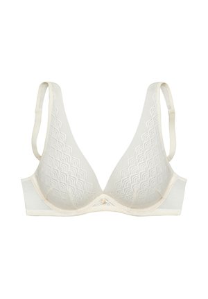 Light beige bra with a lace overlay featuring a wave pattern. Soft fabric, triangular cups, adjustable straps, and decorative button at the center.