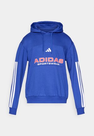 Modrá mikina Adidas s kapucí, bílé pruhy na rukávech, přední klokanková kapsa a červené logo Adidas Sportswear na hrudi.