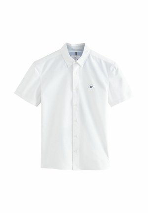 White short-sleeved shirt made of cotton with a button-down collar, featuring a small navy logo on the left chest and subtle striped inside collar.