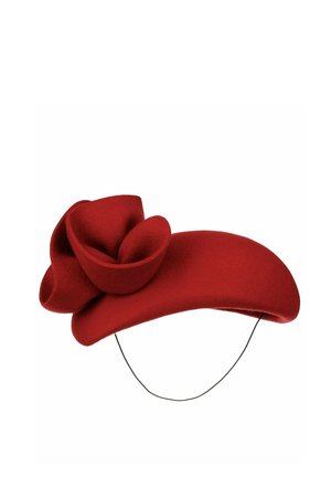 Red felt fascinator hat with a large sculpted flower detail and a thin black chin strap for securing.