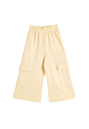 Lys beige cargo bukser lavet af blødt stof, med en elastisk talje og to store frontlommer på hver side. Bred ben-silhuet.