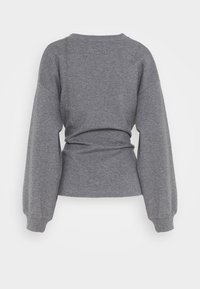 Felpa grigia con maniche lunghe e affusolate e vita aderente. Realizzata in tessuto morbido, presenta un design semplice e senza cuciture sul retro.