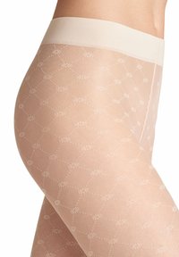 Collant trasparenti a fantasia nuda, caratterizzati da un delicato motivo floreale con una finitura testurizzata e una morbida fascia larga in vita.