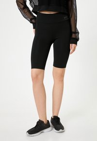 SLIM FIT - Shorts - black