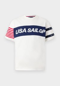White T-shirt with navy horizontal stripe featuring "USA SAILGP" in bold white letters. Red and white striped accents on sleeves. Simple crew neck.