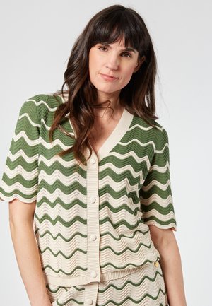 Green and cream wave-patterned cardigan with short sleeves, V-neck, and textured knit fabric. Button closure at the front.