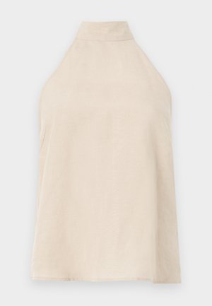 Bež top na halter, brez rokavov, mehak material z gladko teksturo, visok ovratnik in A-linijski kroj. Minimalističen slog.