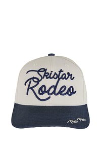 Tejjes sapka krém színű felső résszel és sötétkék napellenzővel. Az elején hímzett "SkiStar Rodeo" felirat sötétkékkel, a napellenzőn pedig "Pico Pico" felirat található.