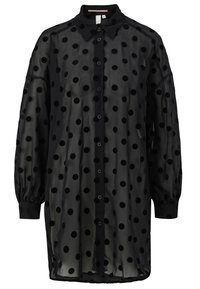 Robe-chemise noire transparente à manches longues avec de grands pois en velours, devant boutonné, poignets ajustés et col pointu.