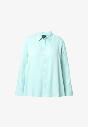 Vaaleanmintunvihreä, kauluksellinen nappipaita, jossa on pitkät hihat ja rento istuvuus. Sileä kangas ilman näkyviä kuvioita tai koristeita.