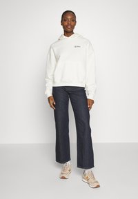 New Balance LINEAR HERITAGE BRUSHED BACK - Sweat à capuche - seasalt