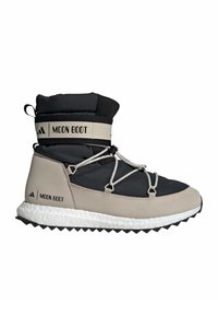 Bota de invierno aislante en negro y beige con suela blanca gruesa, cordones cruzados y la marca "Moon Boot" en la correa del tobillo y el talón.
