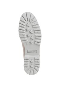 Helle beige Schuhsohle mit einer strukturierten weißen Gumm Oberfläche, die sternförmige Muster und tiefe Rillen für Trittsicherheit aufweist.