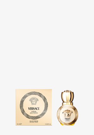 Perfumy Versace Eros pour Femme, 30 ml, w okrągłej szklanej butelce z złotą nakrętką, z wytłaczanymi zdobieniami oraz dekoracyjnym złotym pudełkiem z czarnymi wzorami.